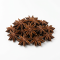 Whole dried star anise pods on a white background