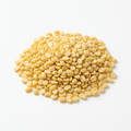 Yellow split moong dal on a white background