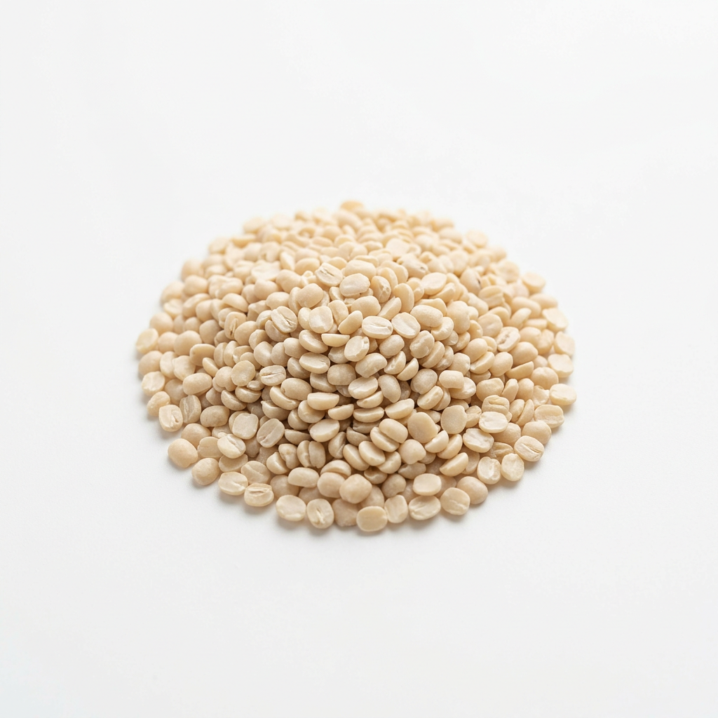 Ivory white split skinned urad dal on a white background
